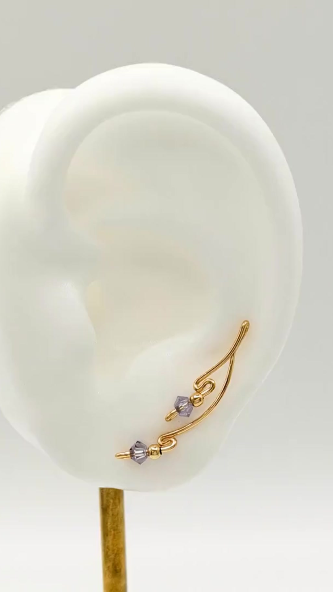 Handcrafted Dolce Collection Ear-Up™ featuring faceted Crystal Tanzanite beads on 14/20KT Gold-Filled wire. Elegant handcrafted ear climber jewelry by Silvia Iglesias.