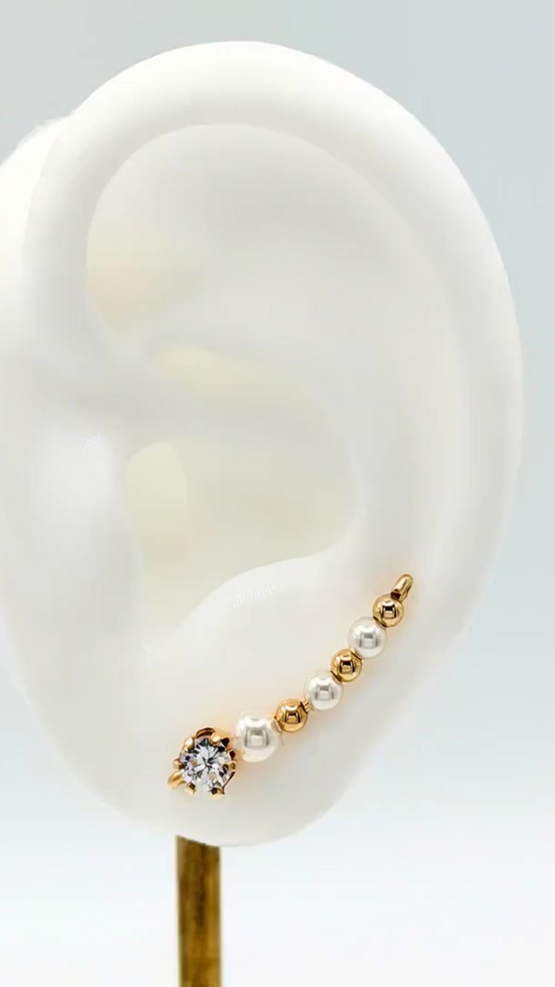 Handcrafted Grazia Collection Ear-Up™ featuring sparkling Clear Cubic Zirconia and luminous Pearl Beads on 14/20KT Gold-Filled wire. Elegant handcrafted Ear-Up™ jewelry designed by Silvia Iglesias.